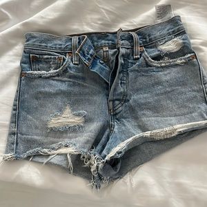 Distressed Levi’s denim shorts (size 25)
